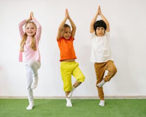 benefits of yoga for kids - 3 kids doing yoga